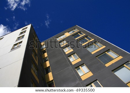 Modern apartment building  against blue sky background