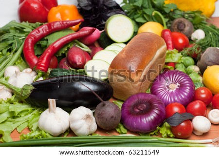 fresh vegetables with bread and fruits, vitamins and minerals