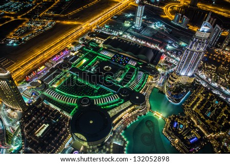 DUBAI, UAE - NOVEMBER 13: Dubai downtown night scene with city lights, luxury new high tech town in middle East on November 13, 2012 in Dubai, UAE.  United Arab Emirates architecture
