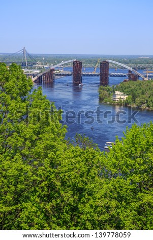 KIEV, UKRAINE - MAY 07: River port and bridge on  a river Dnepr, May 07, 2013, in town Kiev, Ukraine, built in 1157-1961.