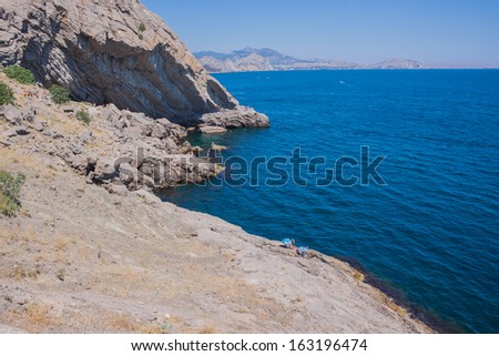 Summer view seacoast. Warm sea and beautiful nature. Sudak beach. Black Sea, Ukraine