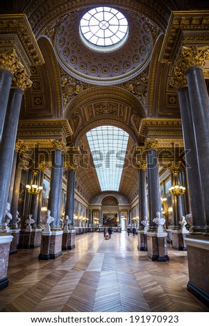 PARIS, FRANCE - MAY 27, 2011: Hall of mirrors full of tourists in the Palace of Versailles on May 27, 2011, France. The Versailles palace is in the UNESCO World Heritage Site list since 1979.