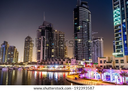 DUBAI, UAE - NOVEMBER 13: Dubai downtown night scene with city lights, luxury new high tech town in middle East. Dubai Marina cityscape,  on November 13, 2012 in Dubai, UAE.
