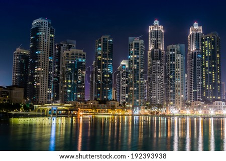 DUBAI, UAE - NOVEMBER 13: Dubai downtown night scene with city lights, luxury new high tech town in middle East, United Arab Emirates architecture on November 13, 2012 in Dubai, UAE