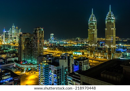 DUBAI, UAE - NOVEMBER 13: Modern skyscrapers in Dubai (emirate and city), UAE. Dubai now boasts more completed skyscrapers higher than 0,8 - 0,25 km than any other city  on 13 November 2012 in Dubai.