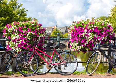 Bicycles on a bridge over the canals of Amsterdam. Amsterdam is the capital and most populous city of the Netherlands