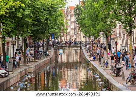 AMSTERDAM, NETHERLANDS - AUGUST 19: Red light district in Amsterdam. Amsterdam is the capital and most populous city of the Netherlands on August 19, 2014