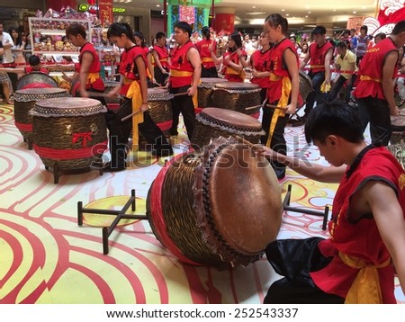KUALA LUMPUR - FEBRUARY 14: Chinese lion dance troupe drum performance in celebration of upcoming Chinese New Year celebrations in Kuala Lumpur February 14, 2015