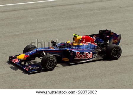 SEPANG, MALAYSIA - APRIL 2: Australian Mark Webber of Team Red Bull accelerates down the back straight at the Petronas Formula 1 Grand Prix April 2, 2010 in Sepang, Malaysia