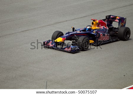 SEPANG, MALAYSIA - APRIL 2: German Sebastian Vettel of Team Red Bull accelerates at the back straight at the Petronas Formula 1 Grand Prix April 2, 2010 in Sepang, Malaysia