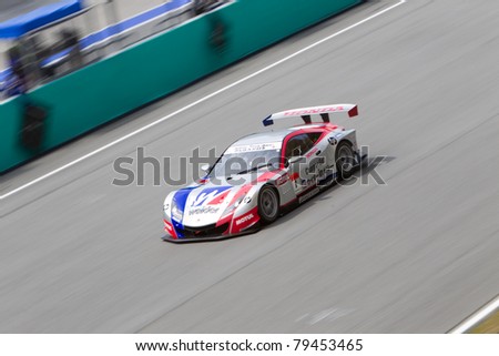 SEPANG, MALAYSIA - JUNE 18: Weider Honda Racing team goes past the pit lane during qualifying at Super GT International series June 18, 2011 in Sepang, Malaysia. Weider took pole position