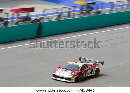 SEPANG, MALAYSIA - JUNE 18: Team Jloc in their Lamborghini going past the pit lane during qualifying at Super GT International series June 18, 2011 in Sepang, Malaysia
