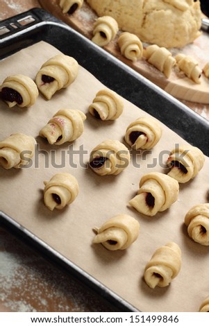 Making Croissant Cookies with Jam. Series. Transfer to baking sheet.