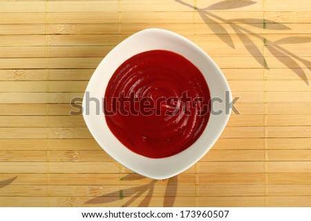 Ketchup in bowl. Directly Above.