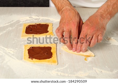Folding over to form triangle. Making Chocolate Croissants with Puff Pastry