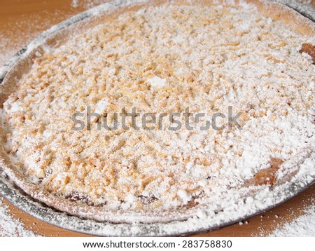 Sprinkle freshly baked pie with powdered sugar. Making Apple Pie Tart Series.