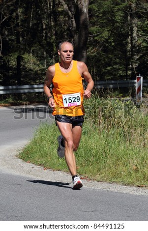 KRYNICA-ZDROJ, POLAND - SEPT 11:The runner Topa Jerzy is running a marathon (control point 39km) at Economic Forum Polish Running Festival September 11, 2011 in Krynica-Zdroj, Poland