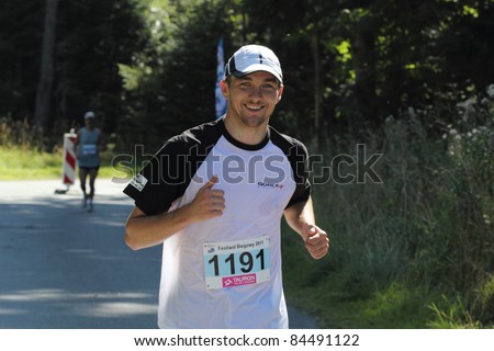 KRYNICA-ZDROJ, POLAND - SEPT 11:The runner Krzemien Pawel is running a marathon (control point 39km) at Economic Forum Polish Running Festival September 11, 2011 in Krynica-Zdroj, Poland