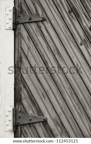 Old door with big hinges.  St. Augustine, FL, USA.