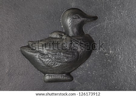 Cast iron baking pan with duck shape.