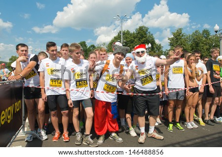 RUSSIA, MOSCOW-JULY 13: Several unidentified runners starting at start line of mass race Adidas energy run at the sports festival \