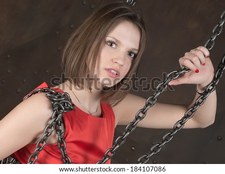 Young beautiful fashion woman in metallic chain