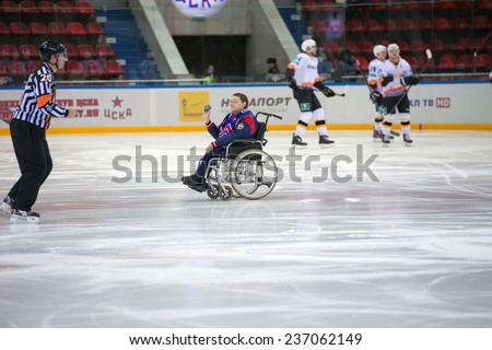 MOSCOW - DECEMBER 3: Unidentified disabled hockey fan on wheelchair just before game CSKA vs Severstal on Russian KHL premier hockey league Championship on December 3, 2014, in Moscow, Russia.