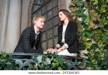 Young people talk on the balcony