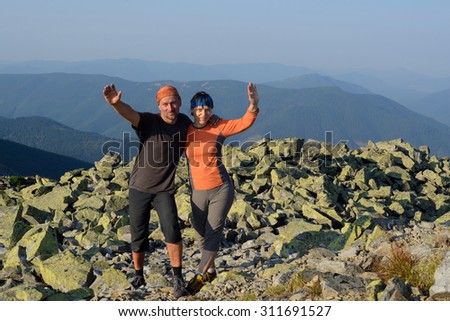 Ukrainian Carpathians. Happy hiker\'s couple hikers on top