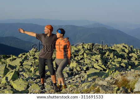 Hike in the Ukrainian Carpathians. Family on a mountain top