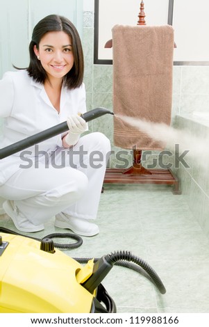 professional cleaning lady at her work, with steam machine, logos removed