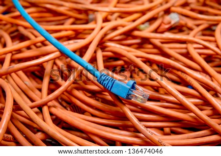 ethernet cables tangled blue and orange