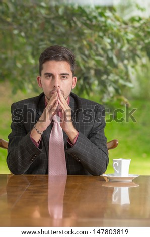 Pensive businessman with concentration at home