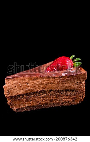 chocolate mousse cake with strawberry on black background