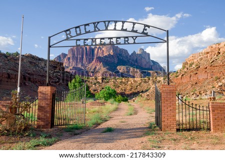 entrance to rockville cemetery in zion national park with mountains in the background