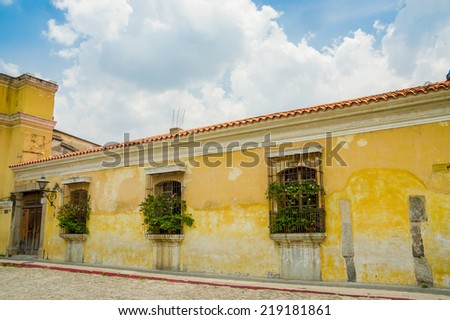 yellow wall colonial architecture in antigua city in guatemala