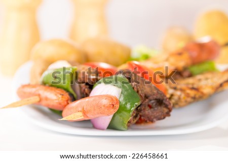 juicy skewers shish kebab sticks grilled meat chicken on a plate closeup selective focus