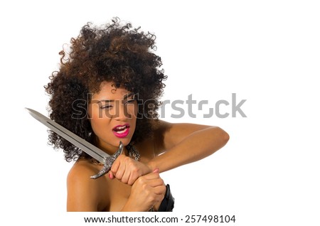 beautiful exotic young tribal woman holding a dagger isolated on white