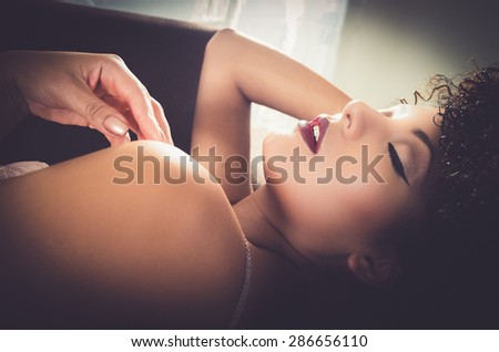 head caption of girl lying down in lingerie with eyes closed