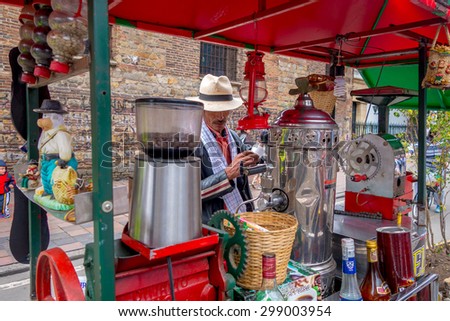 BOGOTA, COLOMBIA - FEBRUARY 25, 2015: Unidentified street vendor selling fresh coffee at Candelaria neighborhood in Bogota Colombia