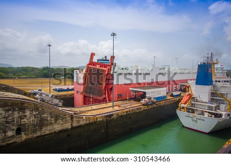 COLON, PANAMA - APRIL 15, 2015: Queen Elizabeth transits the Panama Canal. This is the first set of locks situated on the Atlantic entrance of the Panama Canal.
