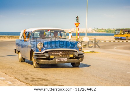 HAVANA, CUBA - AUGUST 30, 2015: Old classic American cars used for taxi and tourist transportation. Before a new law issued on October 2011, cubans could only trade cars that were on the road before