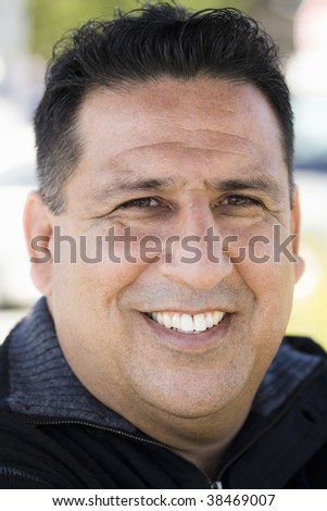 Portrait of a Smiling Overweight Man in Sweater in a Park