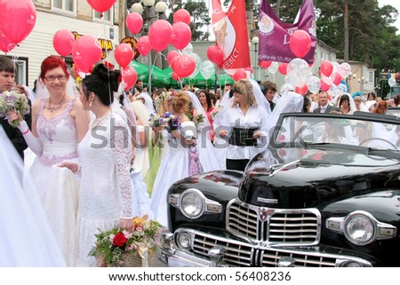 JURMALA - JUNE 13: 2nd annual wedding parade in resort city. Each year many brides from all country are participating in Bride parade - June 13, 2010 in Jurmala, Latvia.