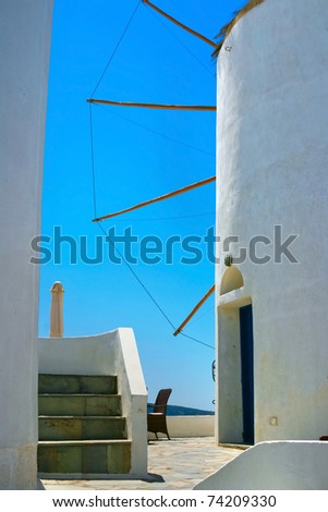 Big windmill in Oia village on island of Santorini, Greece