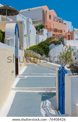 Beautiful empty street and traditional greek architecture on island of Santorini in Fira, Greece.
