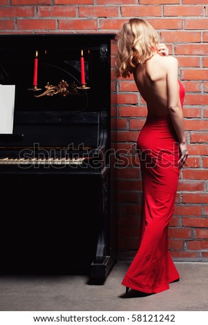 beautiful young woman and piano
