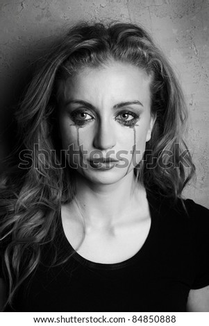 emotional portrait of a young  crying  girl (black and white shoot)