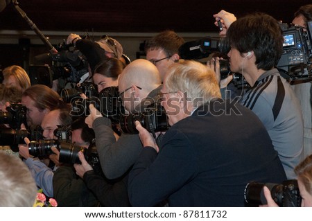 WASHINGTON, DC - OCTOBER 31: Photographers fight for position before a speech by Herman Cain at the National Press Club, October 31, 2011 in Washington, DC