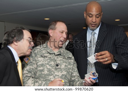 WASHINGTON, DC  APRIL 11: Former Major League Baseball Player Tony Clark signs autographs before a luncheon at the National Press Club, April 11, 2012 in Washington, DC